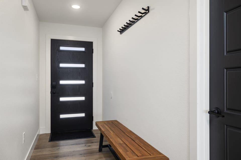 Main Level: Bench and Coat Rack in Entry