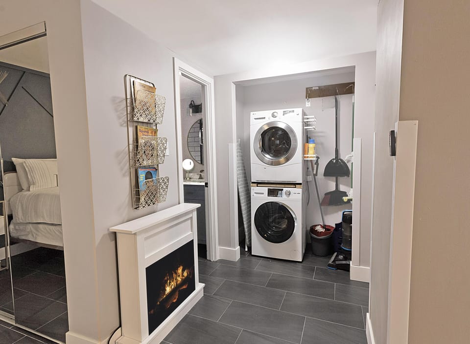 The cozy, electric fireplace in the bedroom.  You'll also enjoy the convenience of the stackable washer/dryer.