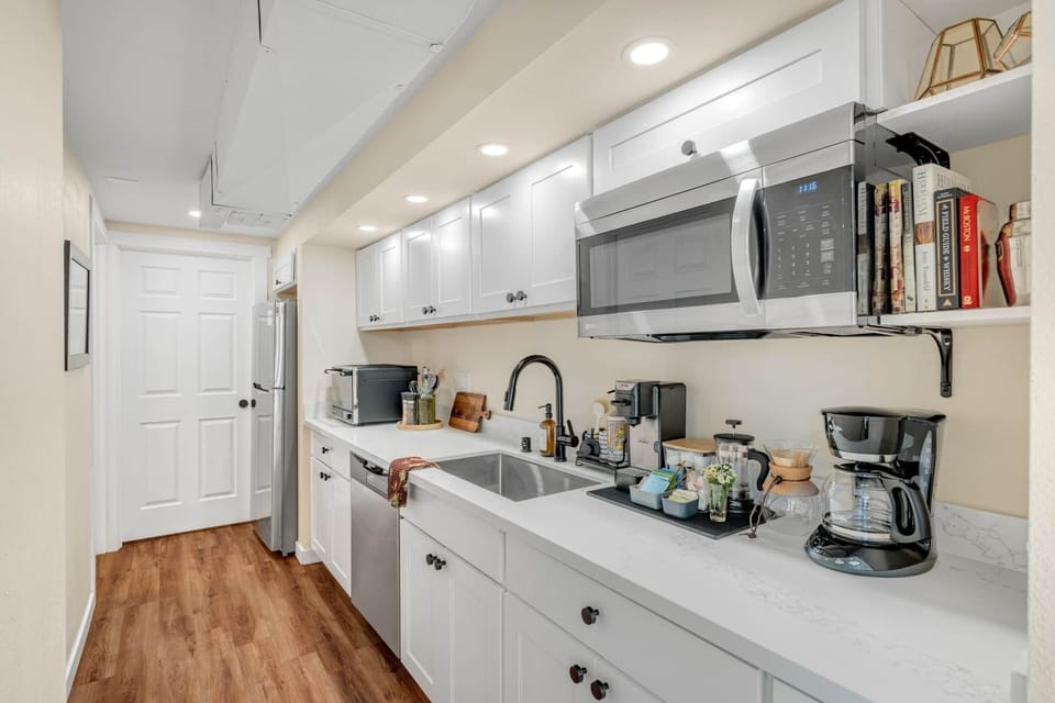 This kitchenette is complete with a refrigerator, microwave & countertop convection oven.