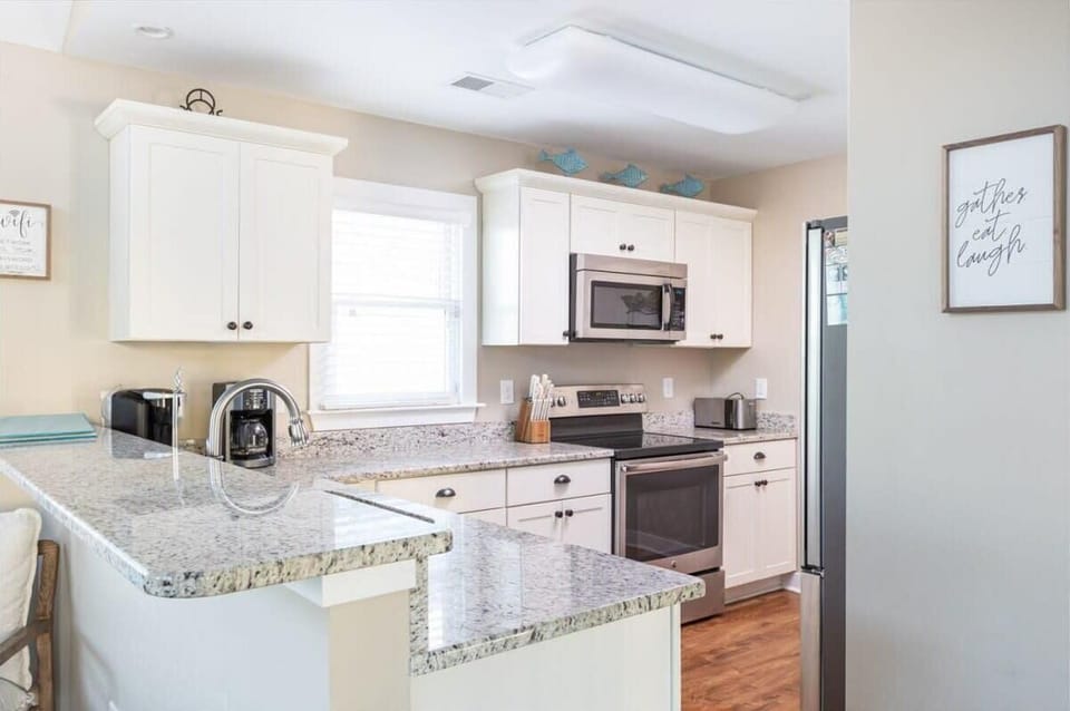 Top level: Fully equipped kitchen with dishwasher. refrigerator, stove, oven, microwave, Keurig & Mr. Coffee drip, blender, hand mixer and much more