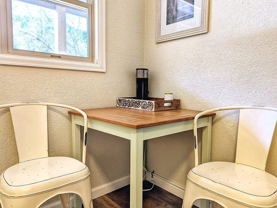  Coffee setup and small table seating, useful for morning routines or light laptop time.
