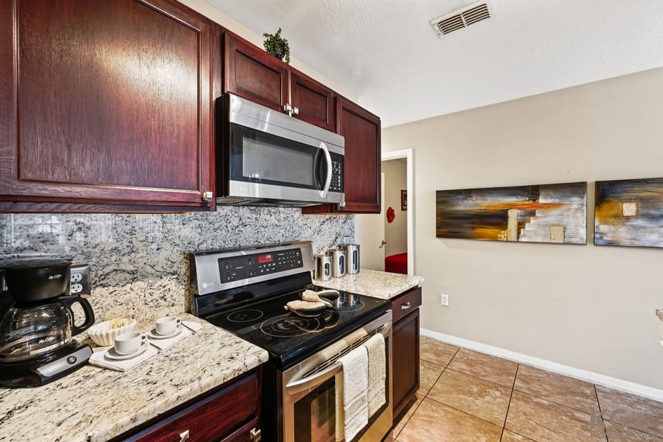 A fully  equipped kitchen with updated appliances