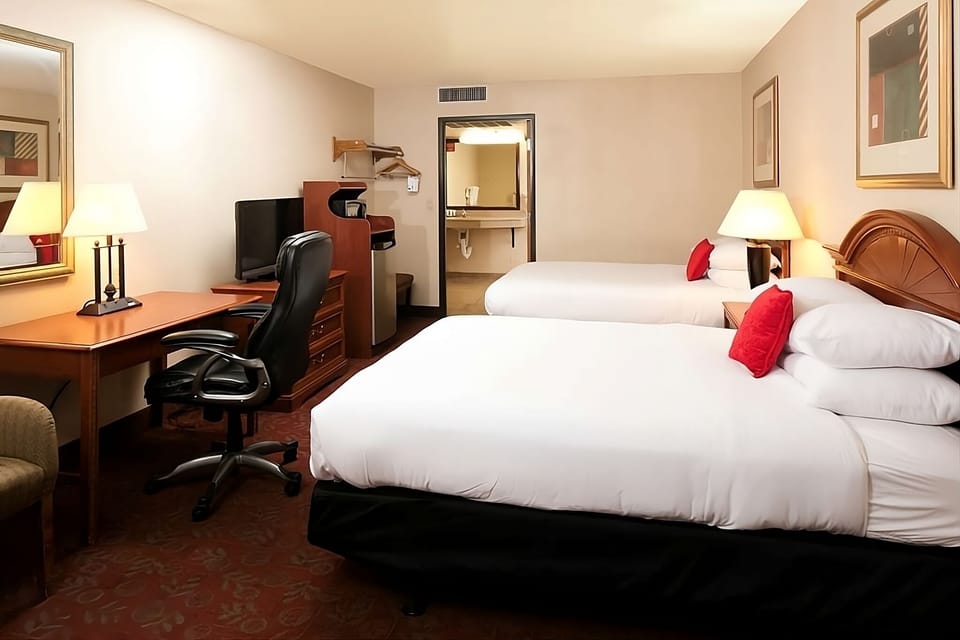 Relax in a roomy double-bed layout with easy bathroom access.