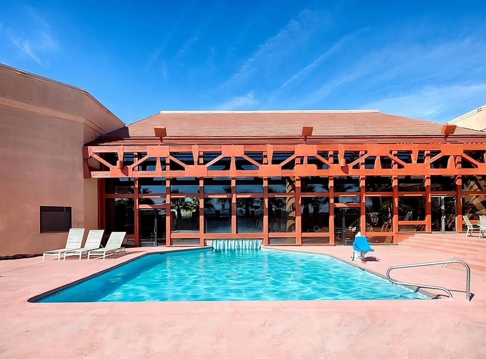 Dive into sunlit serenity with refreshing poolside lounging.