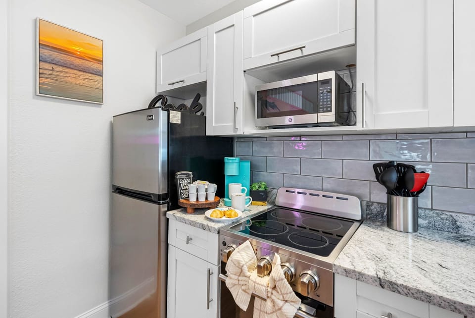 As you step into this chic retreat, you're immediately greeted by a burst of color and a sense of contemporary glamour.