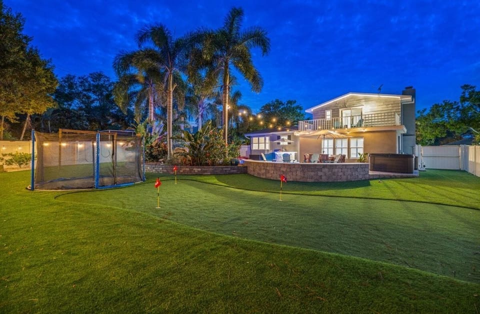 Dream backyard with swing set and in-ground trampoline!