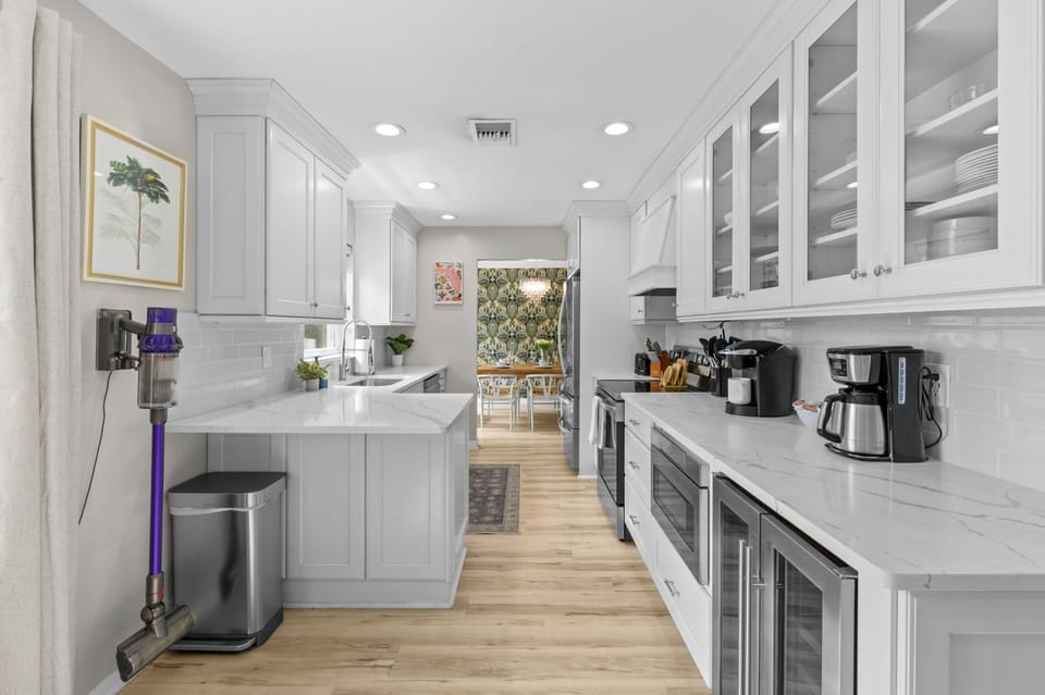 Explore our organized kitchen setup, featuring a handy wall-mounted vacuum cleaner
