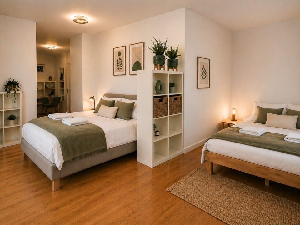 Sleep comfortably with two cozy beds in a bright, inviting space.