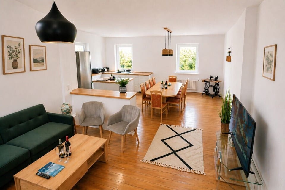 Spacious living, dining, and kitchen area designed for comfort.
