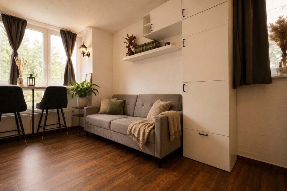 Unwind in this thoughtfully designed living space with natural light, comfortable seating, and a charming dining area ideal for morning coffee or remote work.