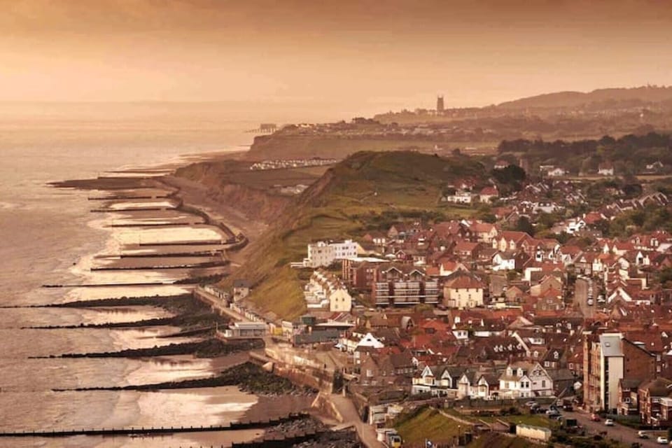 Sunrise over Sheringham’s seafront by local photographer, Chris Taylor