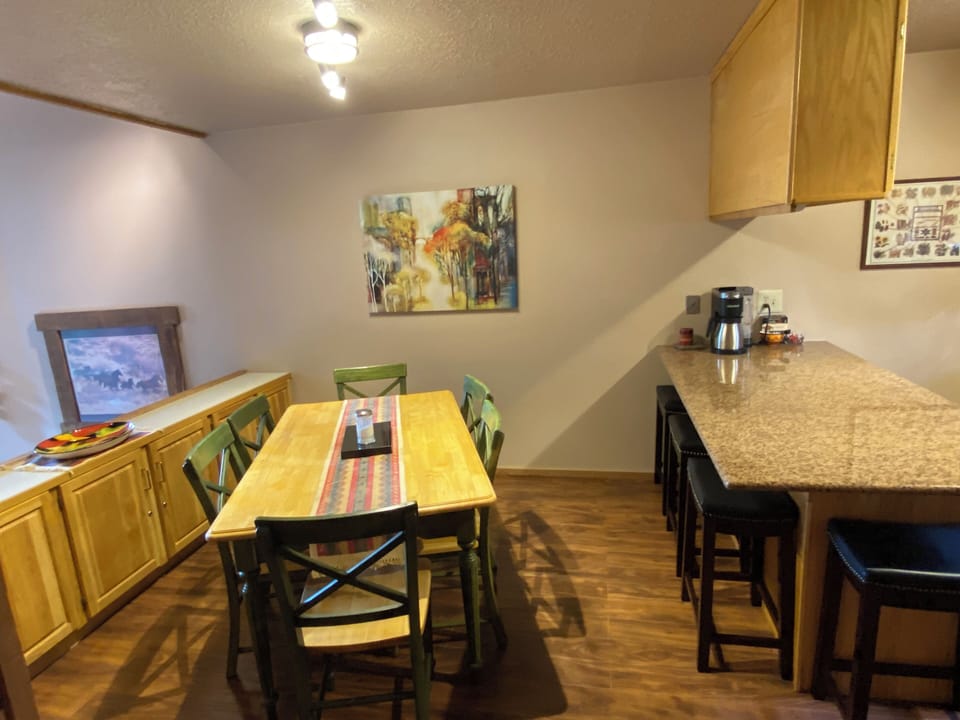 Dining area and bar have seating for ten