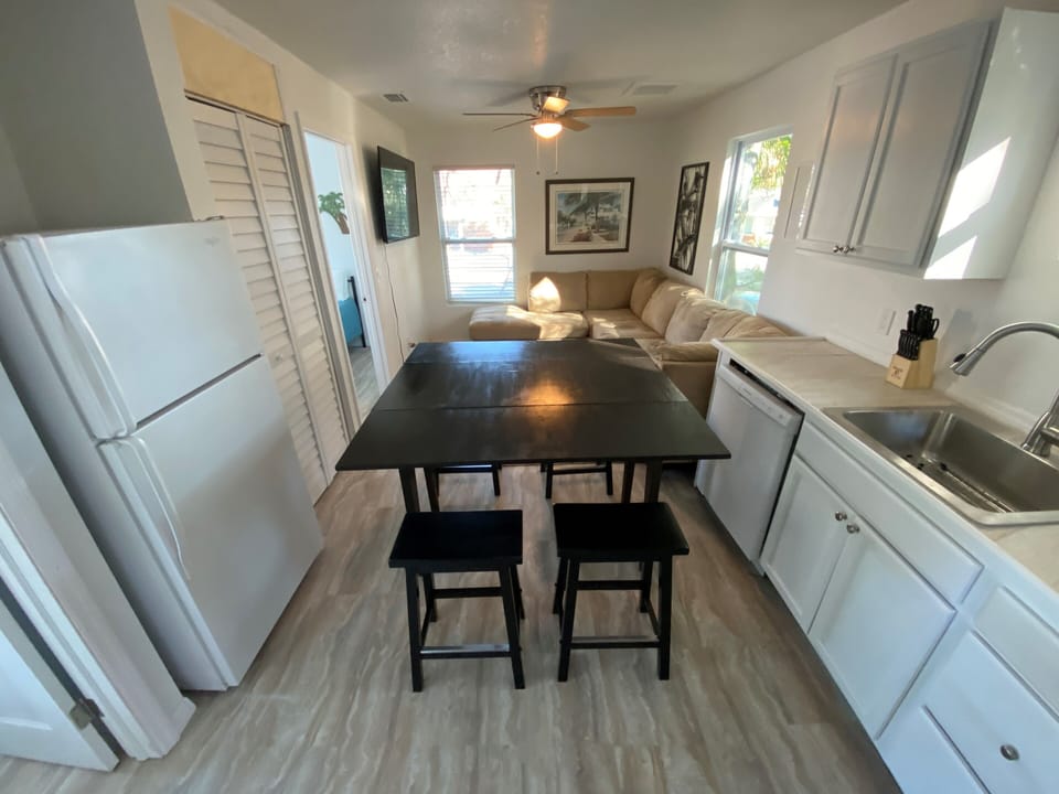 Dining table and 4 stools after deploying the drop-leaf kitchen table