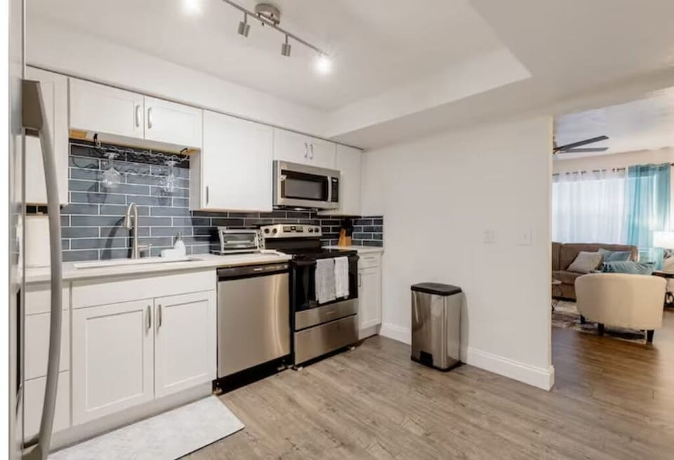 Bran new kitchen with stainless steel appliances and granite countertops. 
