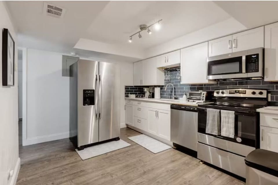 Bran new kitchen with stainless steel appliances and granite countertops. 