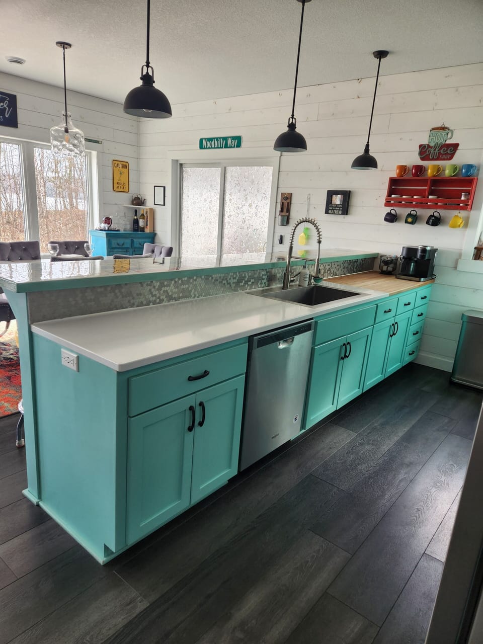 Quartz countertops, butcher block, oversized stainless steel sink and dishwasher