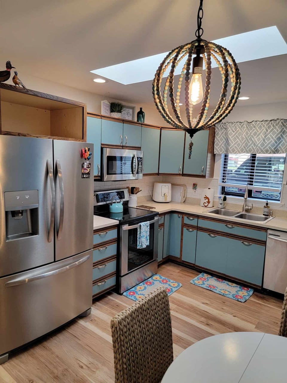 Kitchen has many appliances including an air fryer
