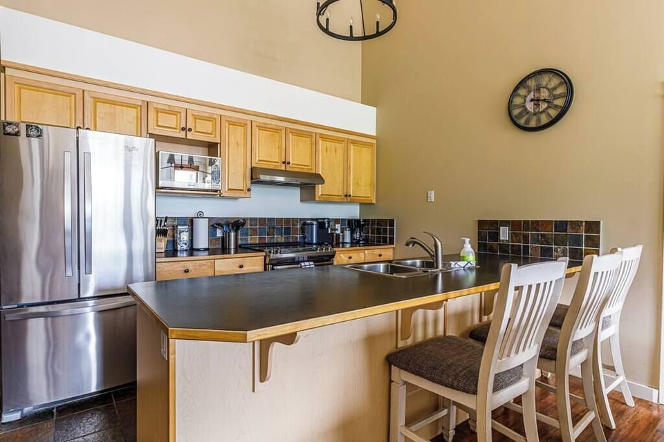 Fully equipped kitchen connected to the dining area.