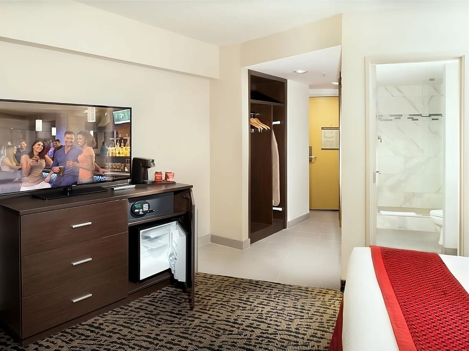 Refresh with convenient in-room fridge, safe, and storage space.