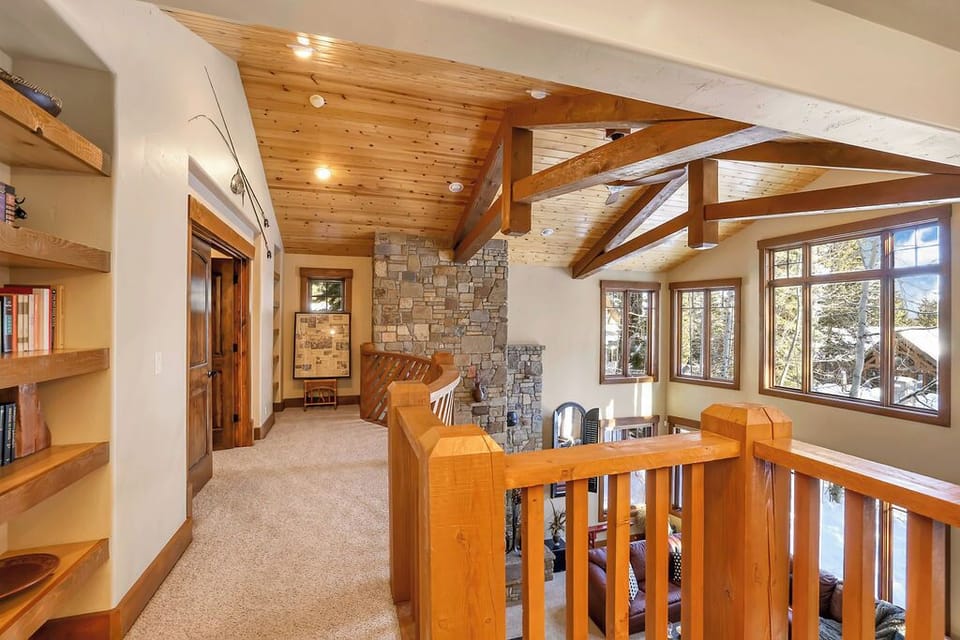 Classic wood-and-stone lodge details—this is a true ski house, not a glass box.