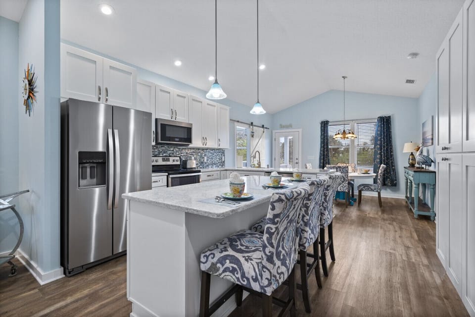 Oversized island with additional seating for three