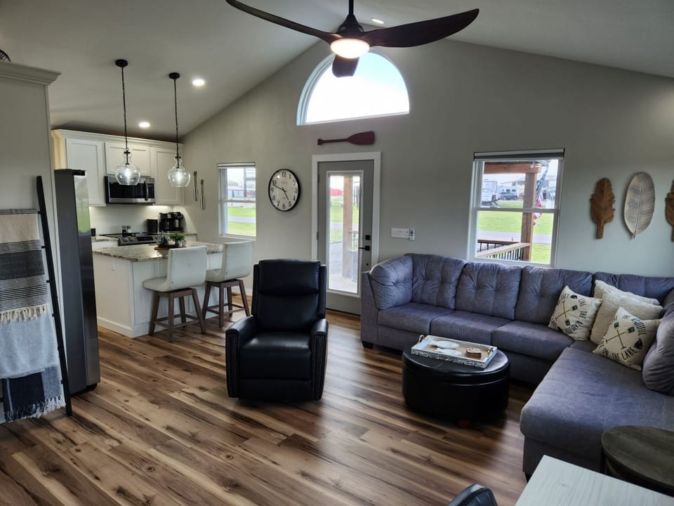 Living room sectional to stretch out on, and leather recliner to relax in.