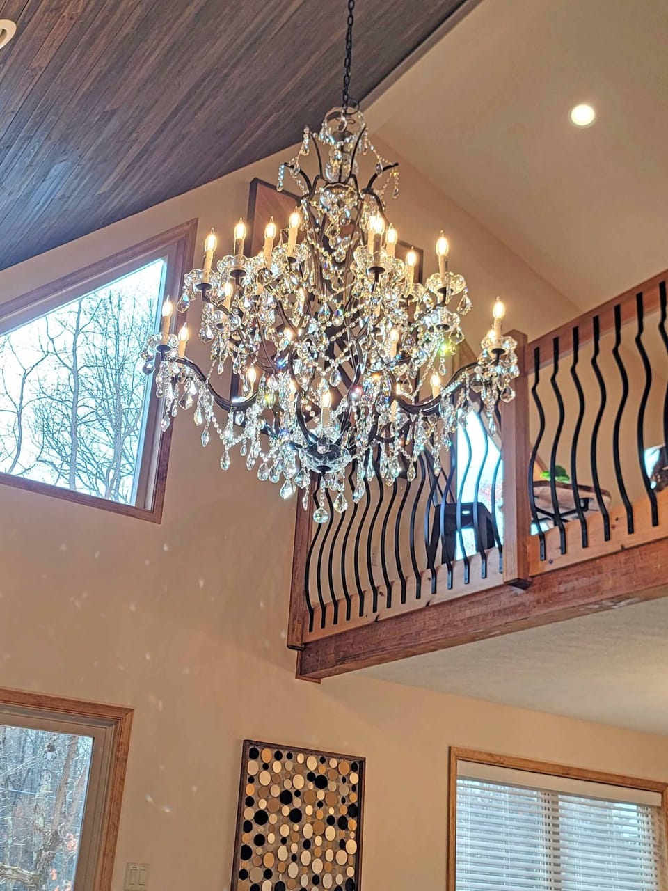 The bold Swarovski crystal chandelier is the true show-stopper of the house!