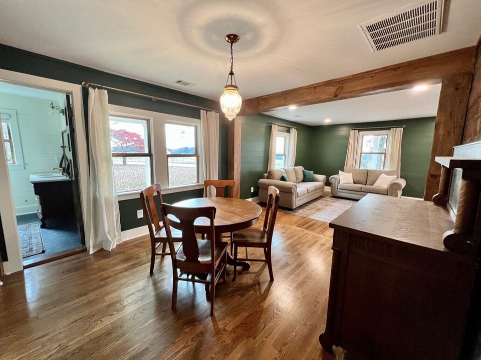 Dining room opens to living room and has an antique buffet for serving & storage