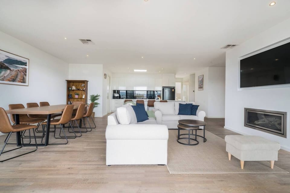 Gather your group for a memorable experience around the expansive dining table, or unwind and enjoy relaxation on the sofa by the indoor fireplace.