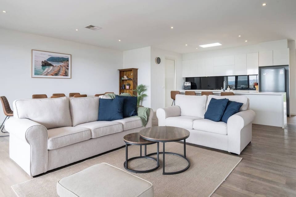 Enjoy the bright, comfy living area that smoothly connects to the kitchen and dining space for easy living and chilling.