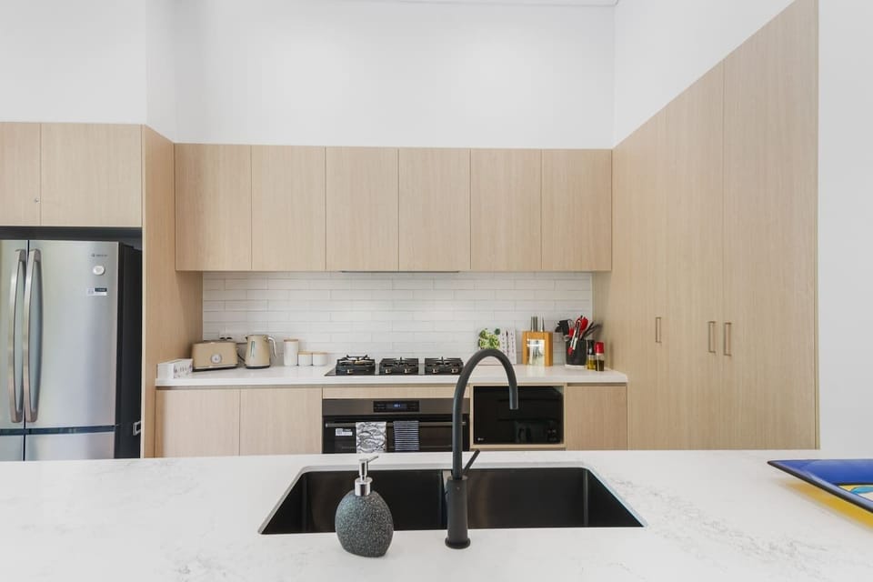 The gourmet kitchen comes fully equipped for your holiday catering with sleek appliances and cooking utensils.
