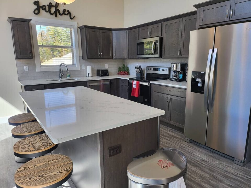 Fully stocked kitchen for large meals and a coffee station.