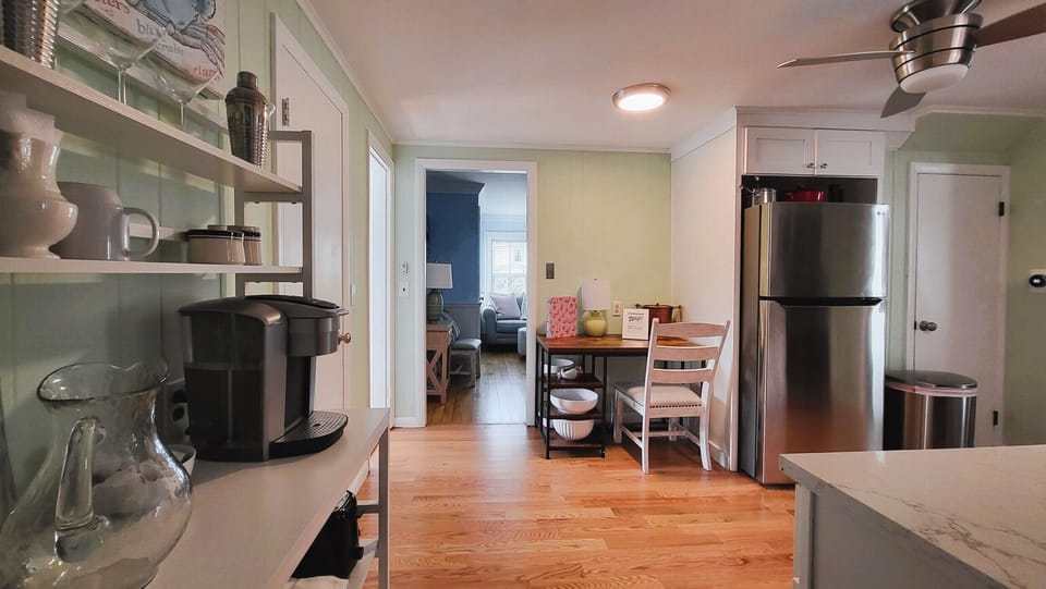 View toward kitchen, coffee maker