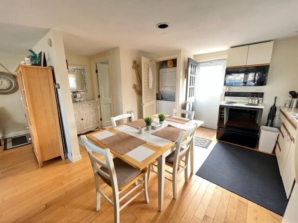 Kitchen area with stacked W/D