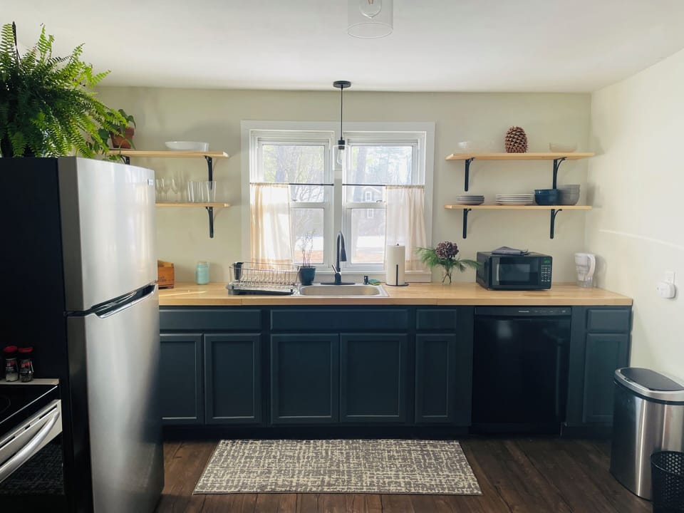 The beautiful open kitchen has all new appliances.