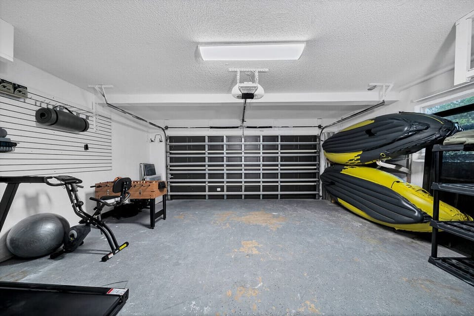 Home gym & game room - enjoy foosball, two kayaks, and exercise equipment