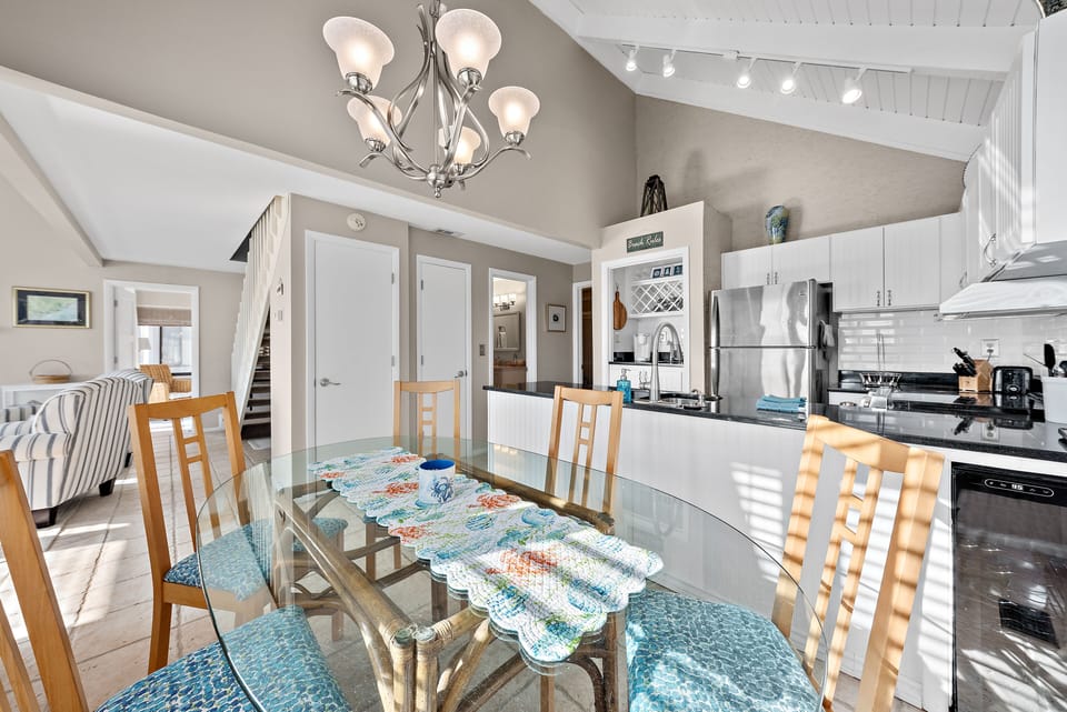 The dining area is off the kitchen and opens to the living area
