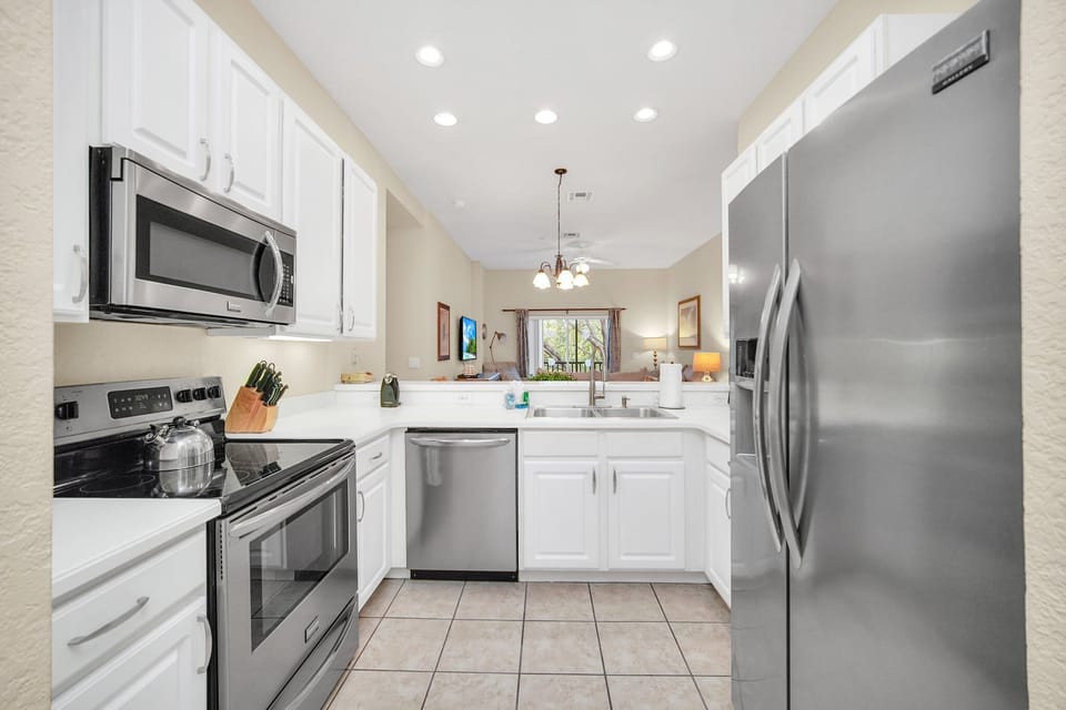 Kitchen is set up with all stainless steel appliances, perfect for the party chef.