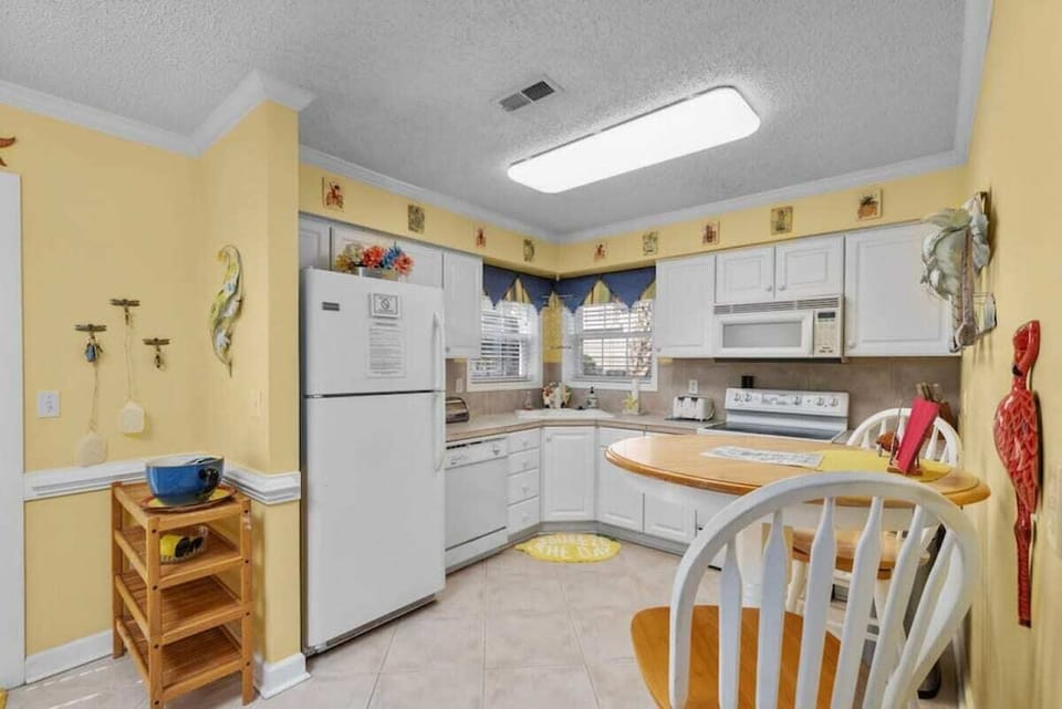 Whip up delicious meals in the spacious full kitchen, fully stocked with everything you need. Bright and functional, it’s perfect for both quick bites and family feasts.