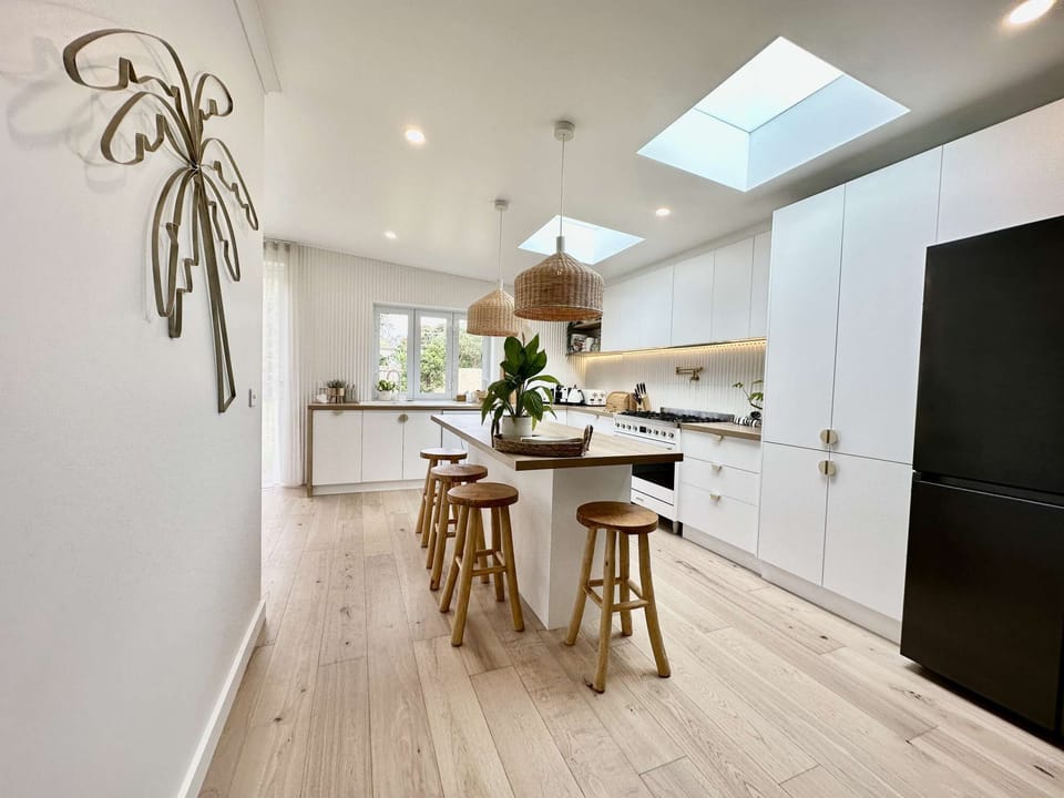 Modern kitchen with Smeg appliances, Samsung Family Hub Fridge with ice machine