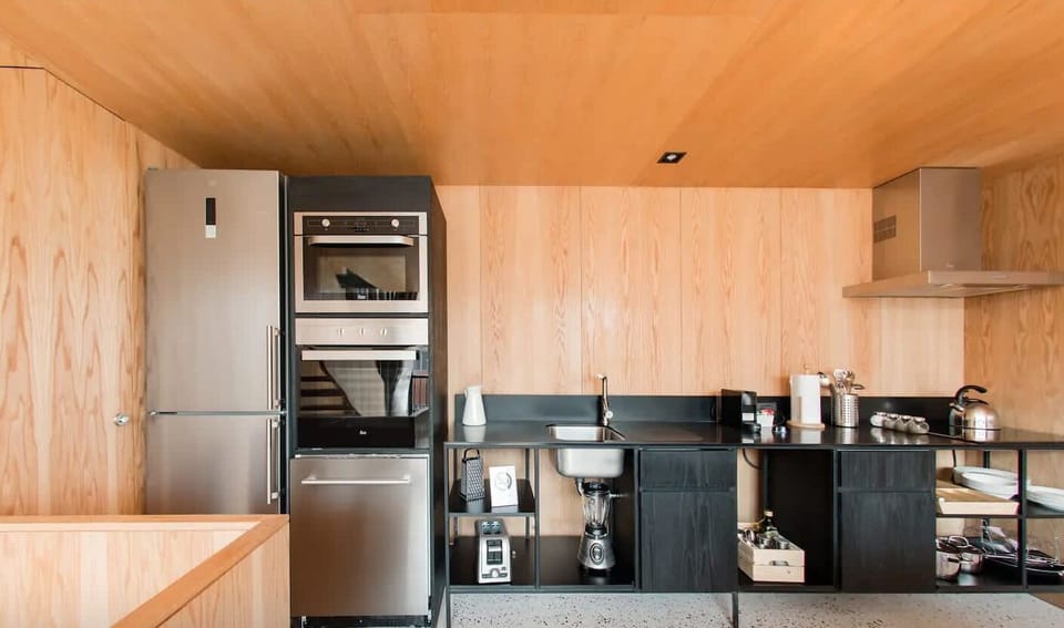 Full kitchen with fridge, stove, microwave, and coffee maker—everything you need to cook real meals.