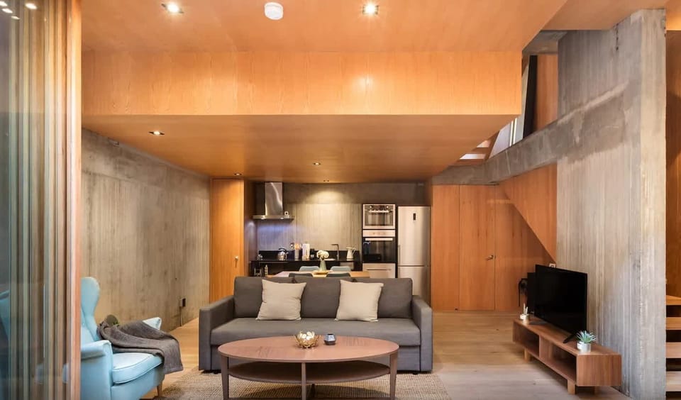 Modern furniture and natural materials create a space that feels both stylish and livable.