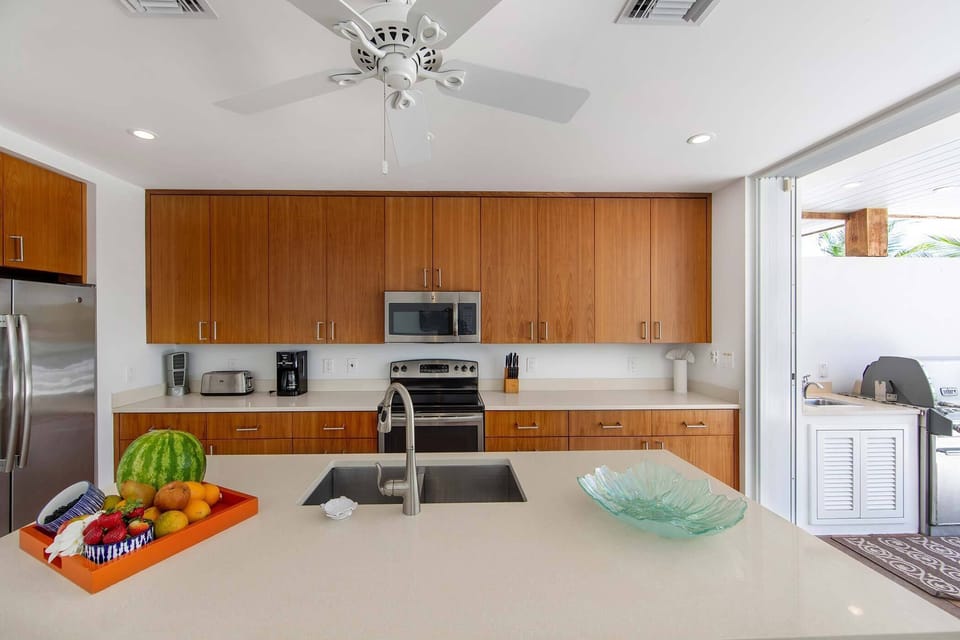 Kitchen opens to exterior grilling area