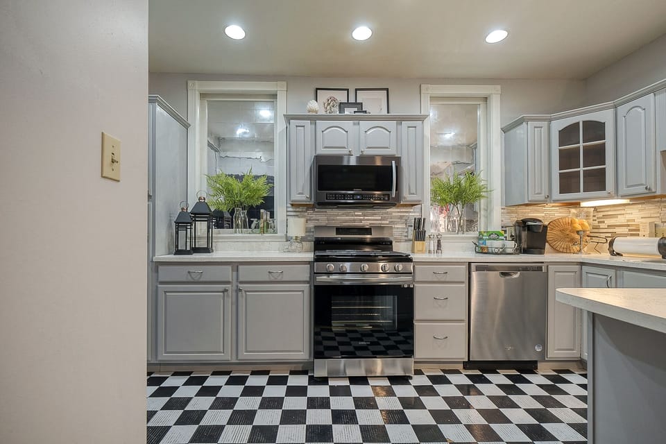 Kitchen with modern equipment and victorian style cupboards