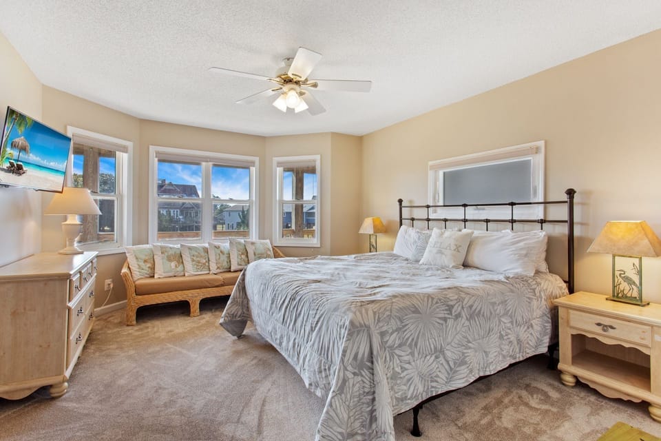 The Mid-Level King Master Bedroom has its own sofa and plenty of natural lighting and beautiful views.