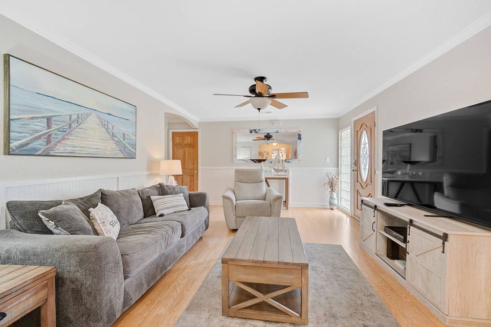 Enjoy a movie on the large screen TV or a book on the comfortable couch