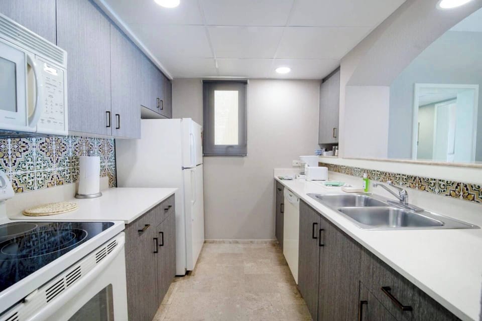 Full kitchen with all the necessities to cook a meal.