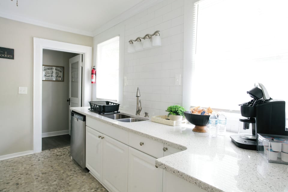 LOVE the natural light in this fresh kitchen remodel!