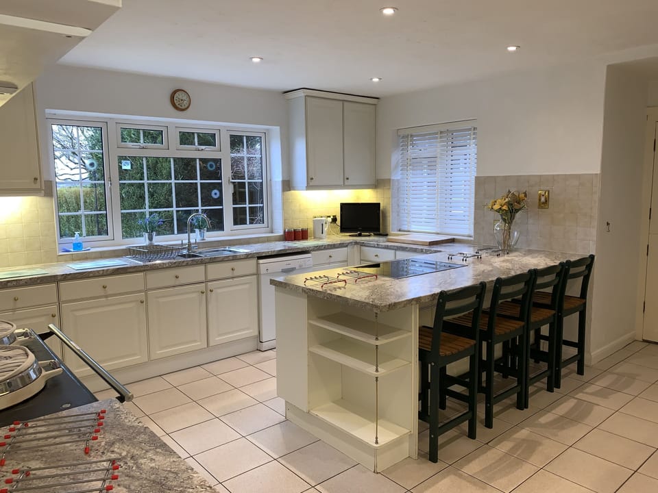 LARGE KITCHEN LEADING ON TO THE UTILITY ROOM.