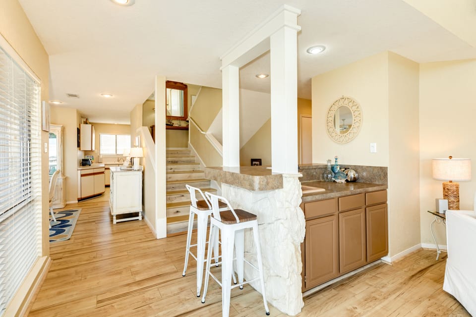 Grab your favorite drink from the adjacent wet bar
